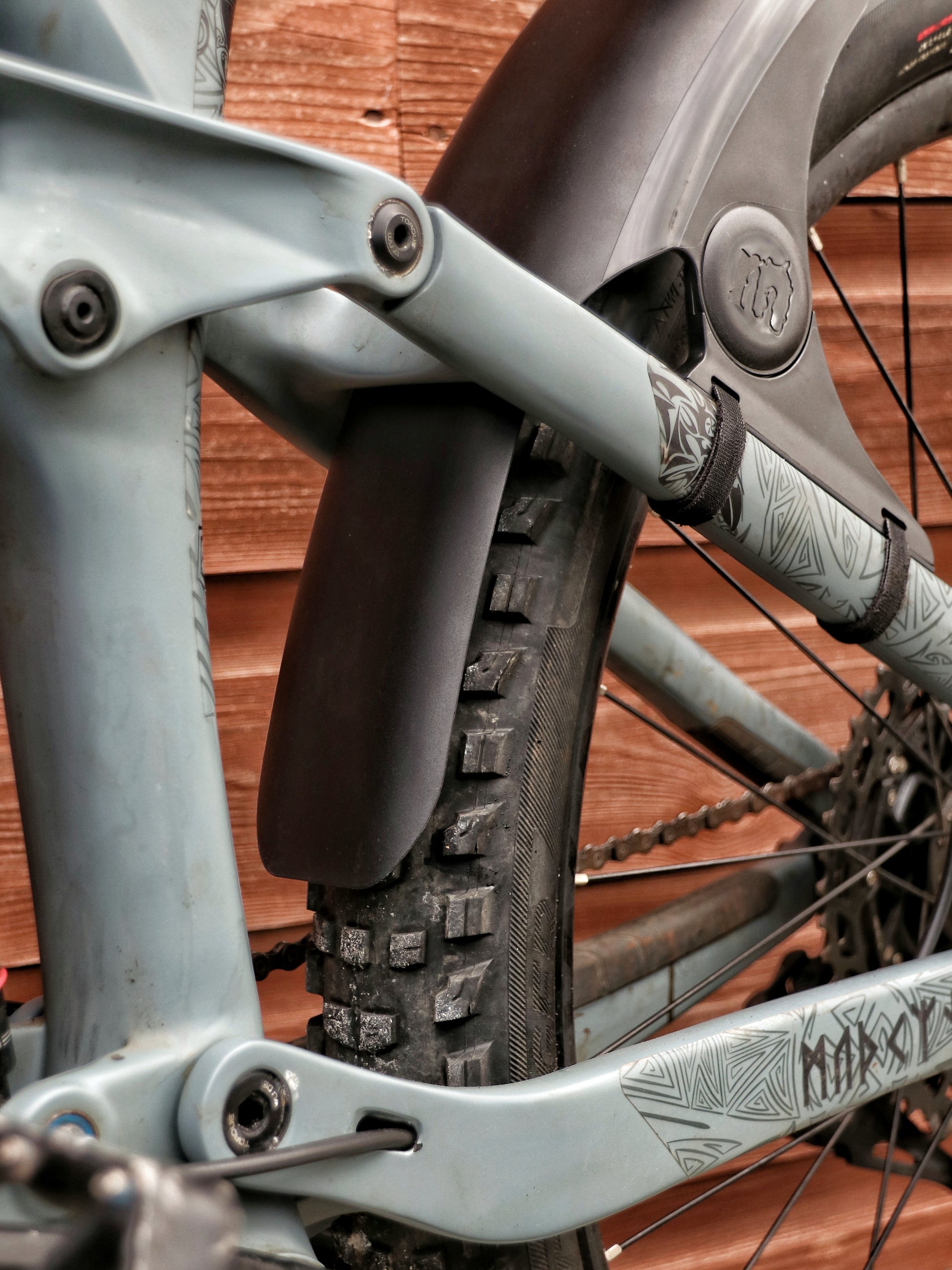 Mucky Nuts Rear MugGuard mudguard, long setup, 3 quarter view close up on bike, recycled plastic